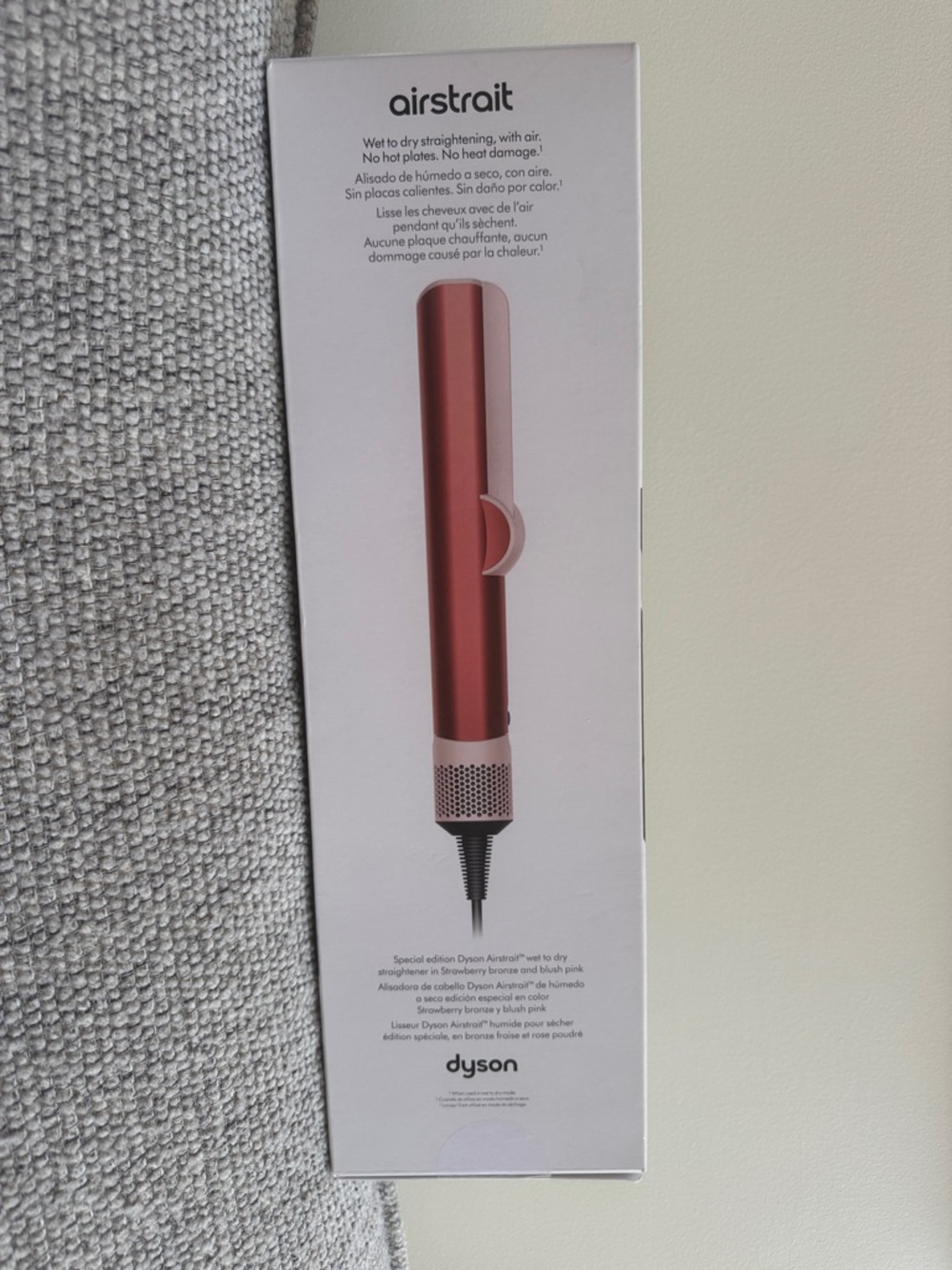 Dyson hair straightening tool in metallic rose and blush pink